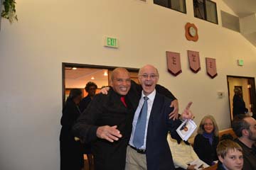 Band Director of “The Power of Love” Leon Smith with videographer Deacon Stephan Fuelling PHOTO: Robert Roy