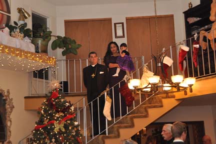 Bishop Gene and Radheka Savoy prepare to welcome the crowd on Epiphany Eve. PHOTO: Stephan Fuelling