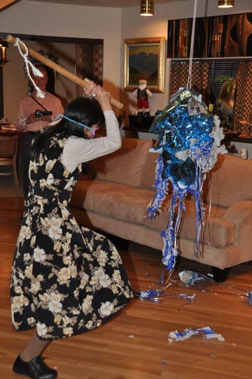 Shinobu Uwataki positions to take her turn at hitting the pinata. PHOTO: Stephan Fuelling