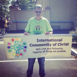 Rev. Harold Boulette shows off the ICC banner before the parade.