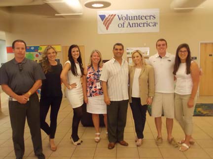 Bishop Gene Savoy Jr. met Reno mayoral candidate Hillary Shieves at a Volunteers of America board meeting this August. Gene and Hillary attended ice-skating lessons together as teenagers during the 1980s. Gene and Hillary are third and fourth from the right in the photo. PHOTO: Sandy Isham