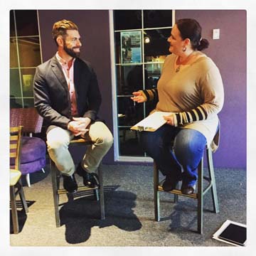 Rt. Rev. Sean Savoy being interviewed on diversity issues by teacher Emily Reese for Multicultural Day at Rain Shadow Community Charter High School.